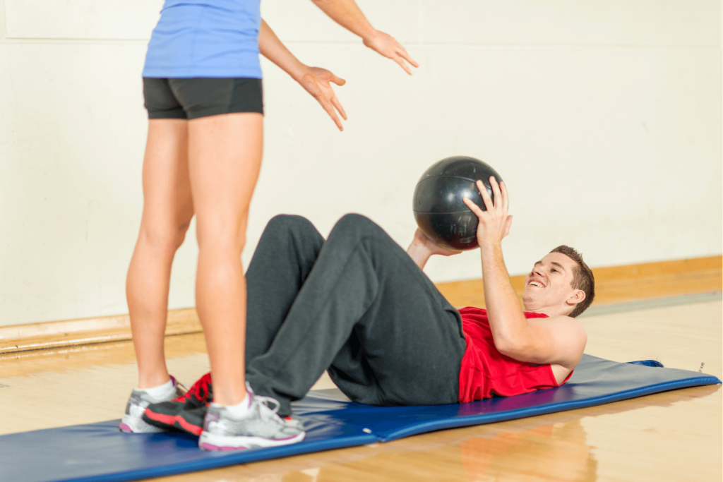 2 person ab workout with a medicine ball